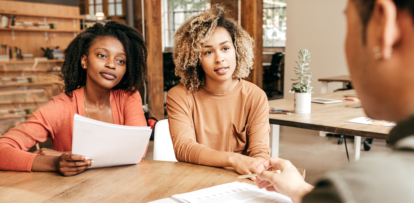 two black small business owners learning about SBA loans